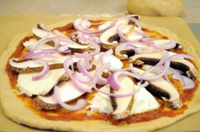 Add the mushroom slices and red onion