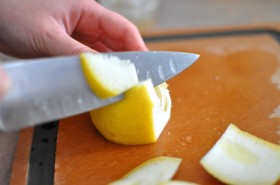 Cutting the peels off the lemons